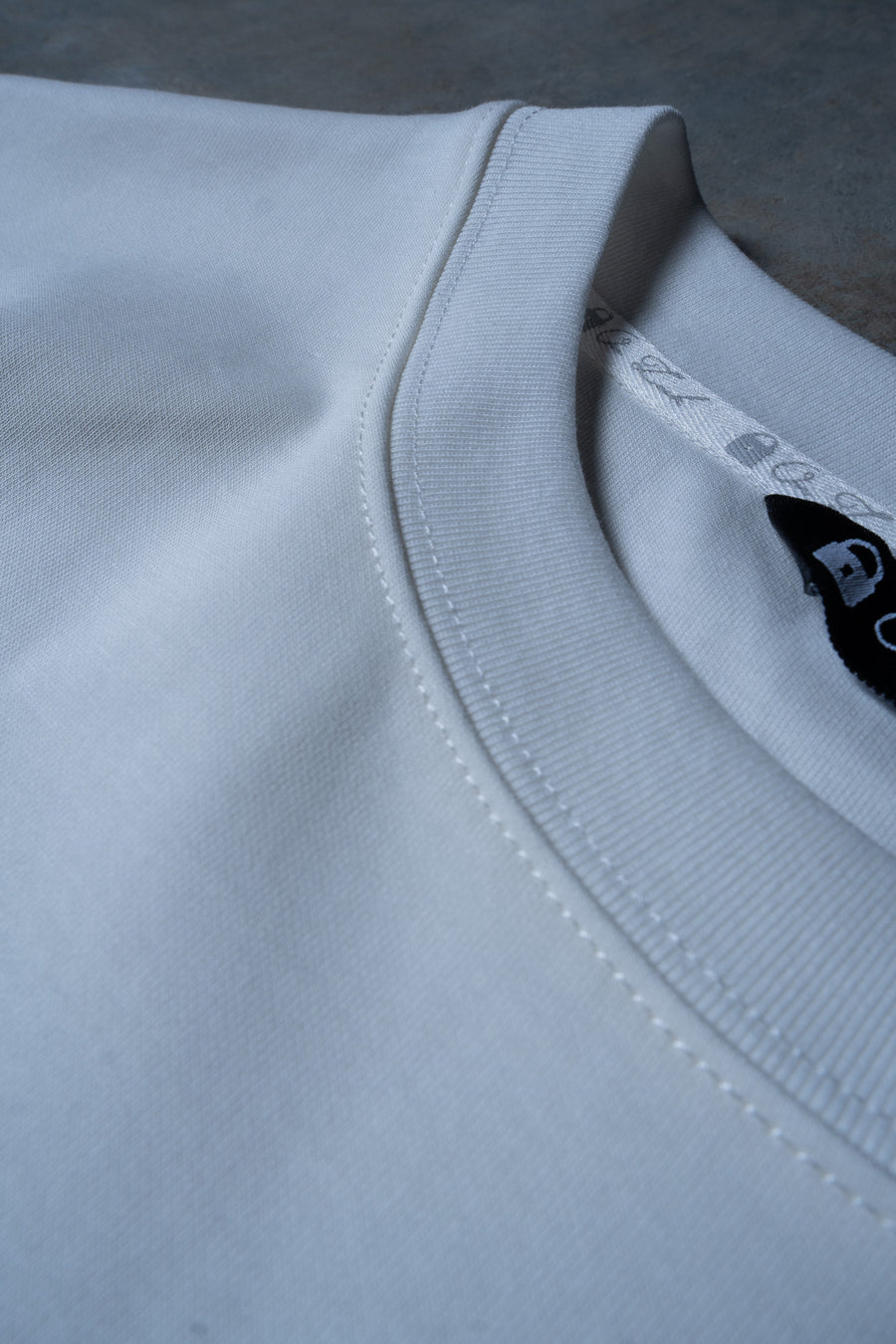 SUPREME TEE - SOFT WHITE EMBOSSED