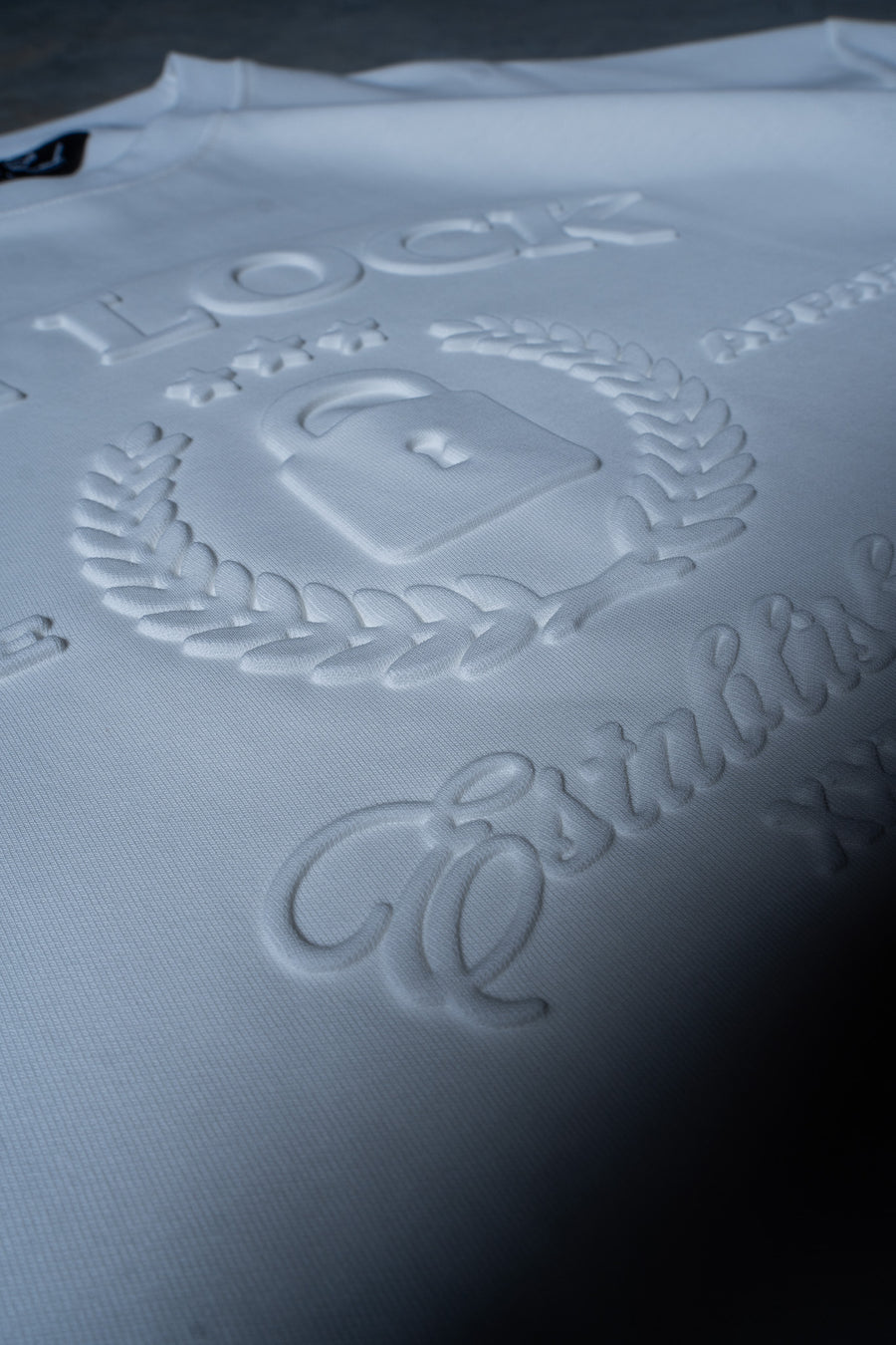 SUPREME TEE - SOFT WHITE EMBOSSED